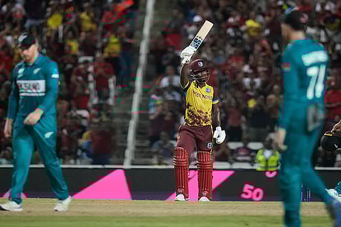 Sherfane Rutherford celebrates after scoring 50 runs